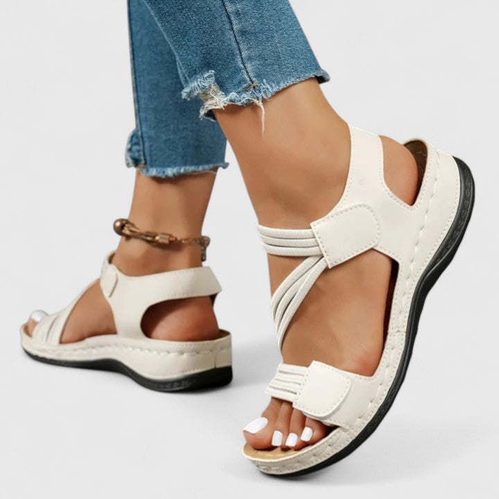 Sophisticated slip-on sandals for women, offering comfortable arch support & foot pain relief.