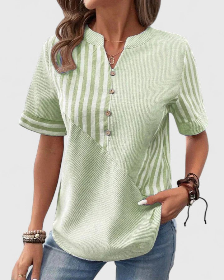 Women's sophisticated pink striped blouse, ideal for office or casual chic. Elegant versatile fashion.