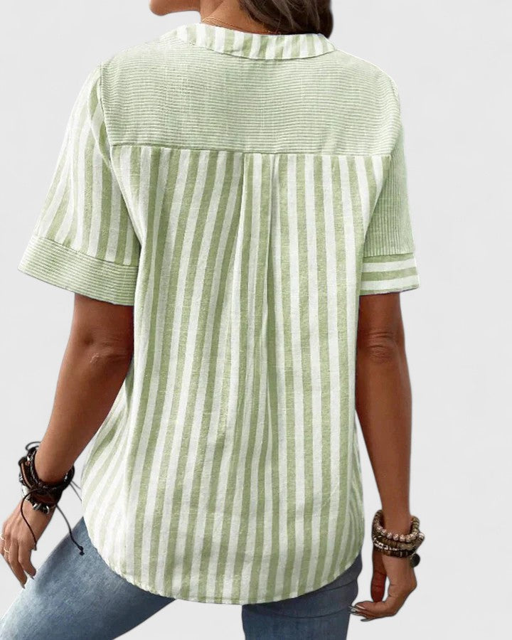 Fashionable women's striped blouse, a sophisticated everyday top for work or chic casual wear.