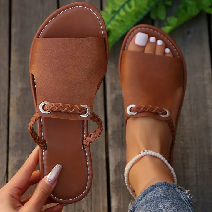 Chic women's braided thong flat sandals, perfect for casual summer style & everyday wear.