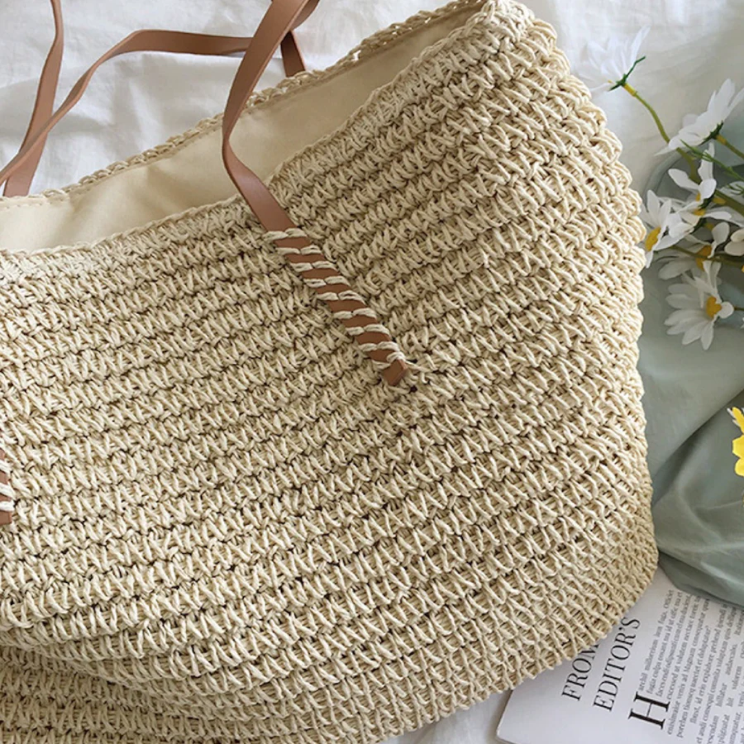 Detailed view of the sturdy shoulder strap on a TerraWoven women's spacious handbag. Elegant and durable.