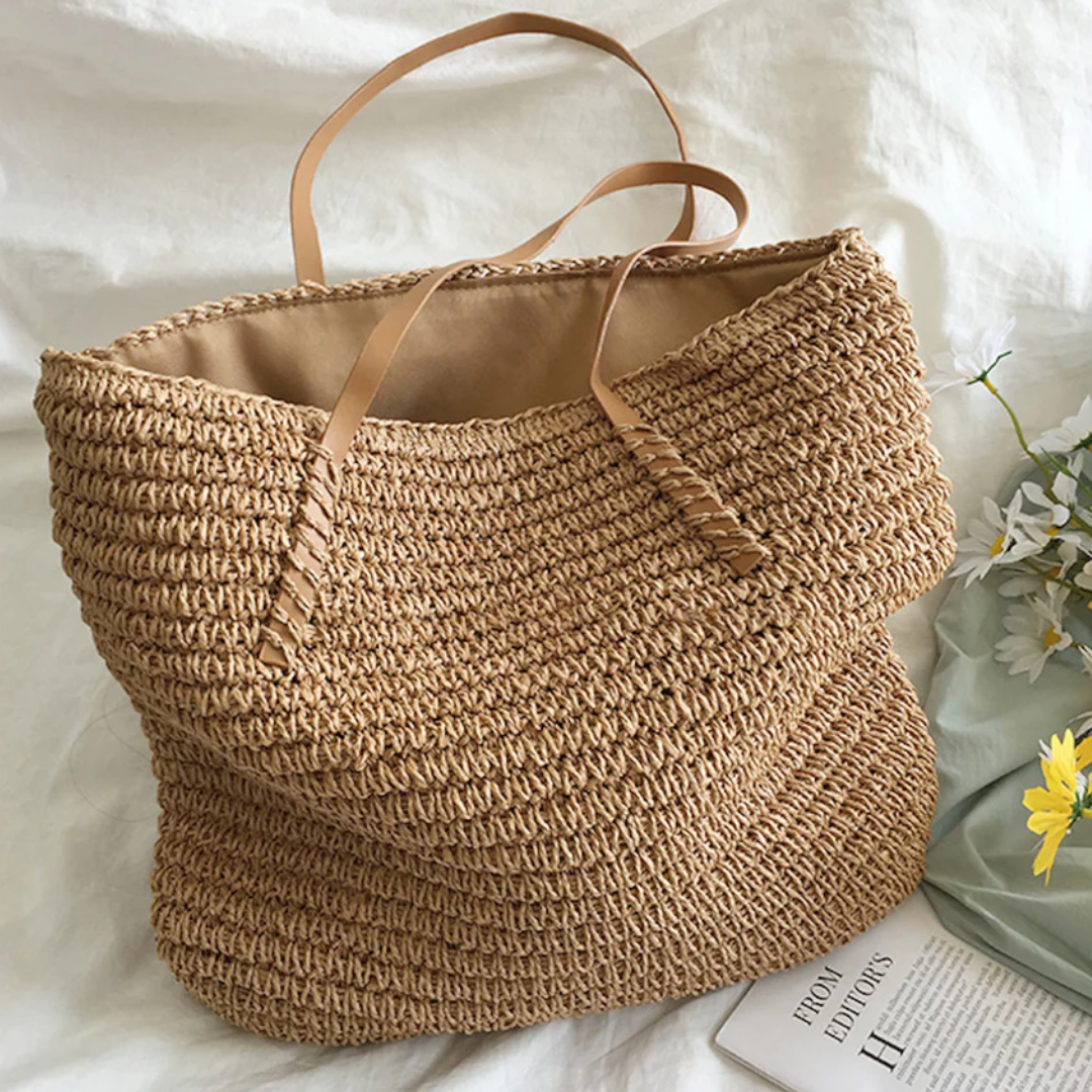 Front view of the TerraWoven women's handbag, showcasing its spacious design, elegant woven pattern, and sturdy strap.