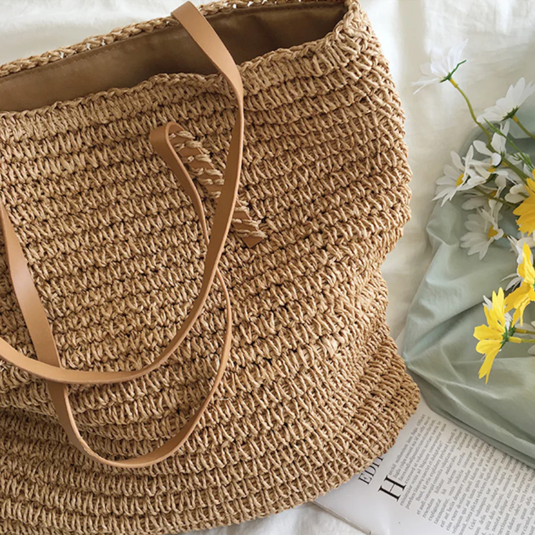 Stylish TerraWoven spacious shoulder bag, carried by a woman. Elegant design, perfect for versatile daily carry.