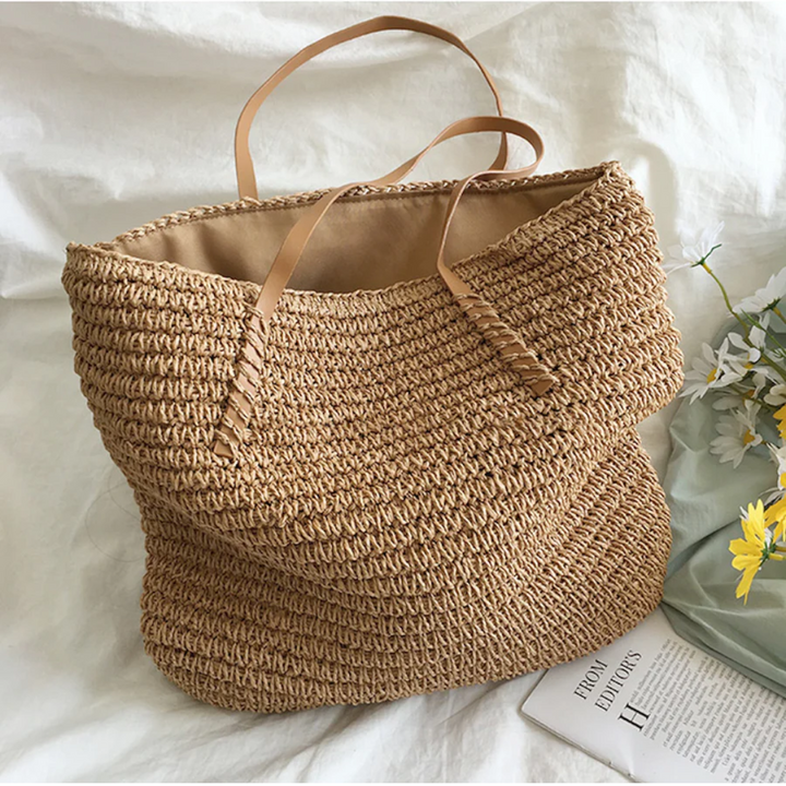 Brown TerraWoven women's handbag, spacious, with a sturdy strap & elegant woven design. Ideal for daily essentials.