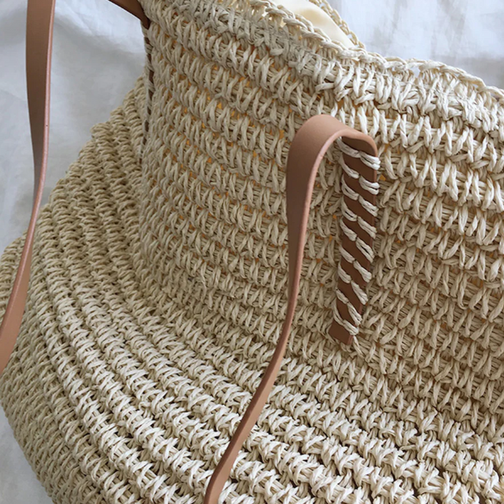 TerraWoven spacious handbag for women, highlighting its practical interior and elegant woven design. Daily carry essential.