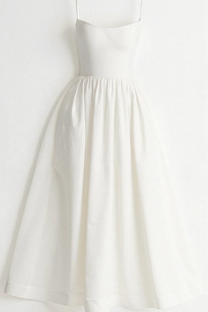 Women's casual midi sundress with spaghetti straps, perfect for spring fashion and summer vacation wear.