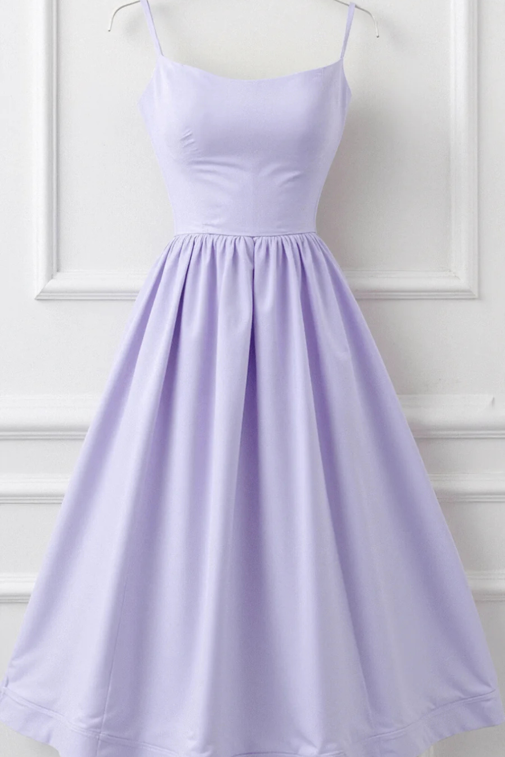Sleeveless women's midi sundress with spaghetti straps, a must-have for summer fashion.