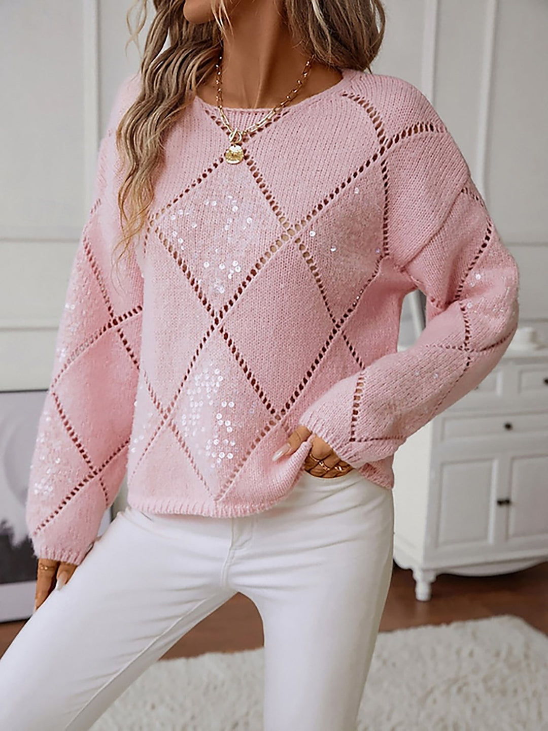 Versatile women's crew neck sweater. Sparkle knit fabric showcases a beautiful sequin diamond design.