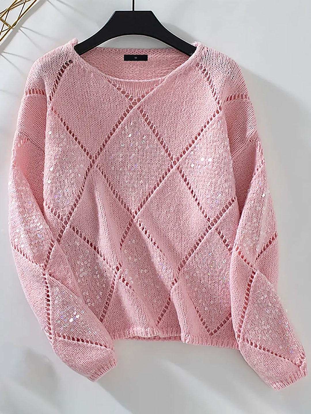 Elegant women's sparkle knit sweater with sequin diamond pattern. Relaxed fit for comfortable, stylish wear.