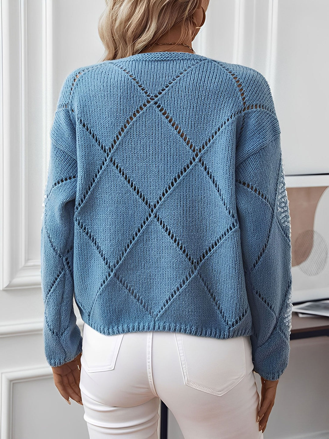 Relaxed fit women's crew neck sweater. Features a dazzling sequin diamond pattern on sparkle knit fabric.