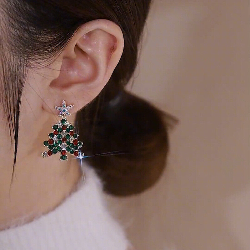 Shimmering women's Christmas tree earrings, a perfect festive jewelry accessory for holiday fun.