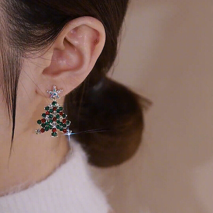 Shimmering women's Christmas tree earrings, a perfect festive jewelry accessory for holiday fun.