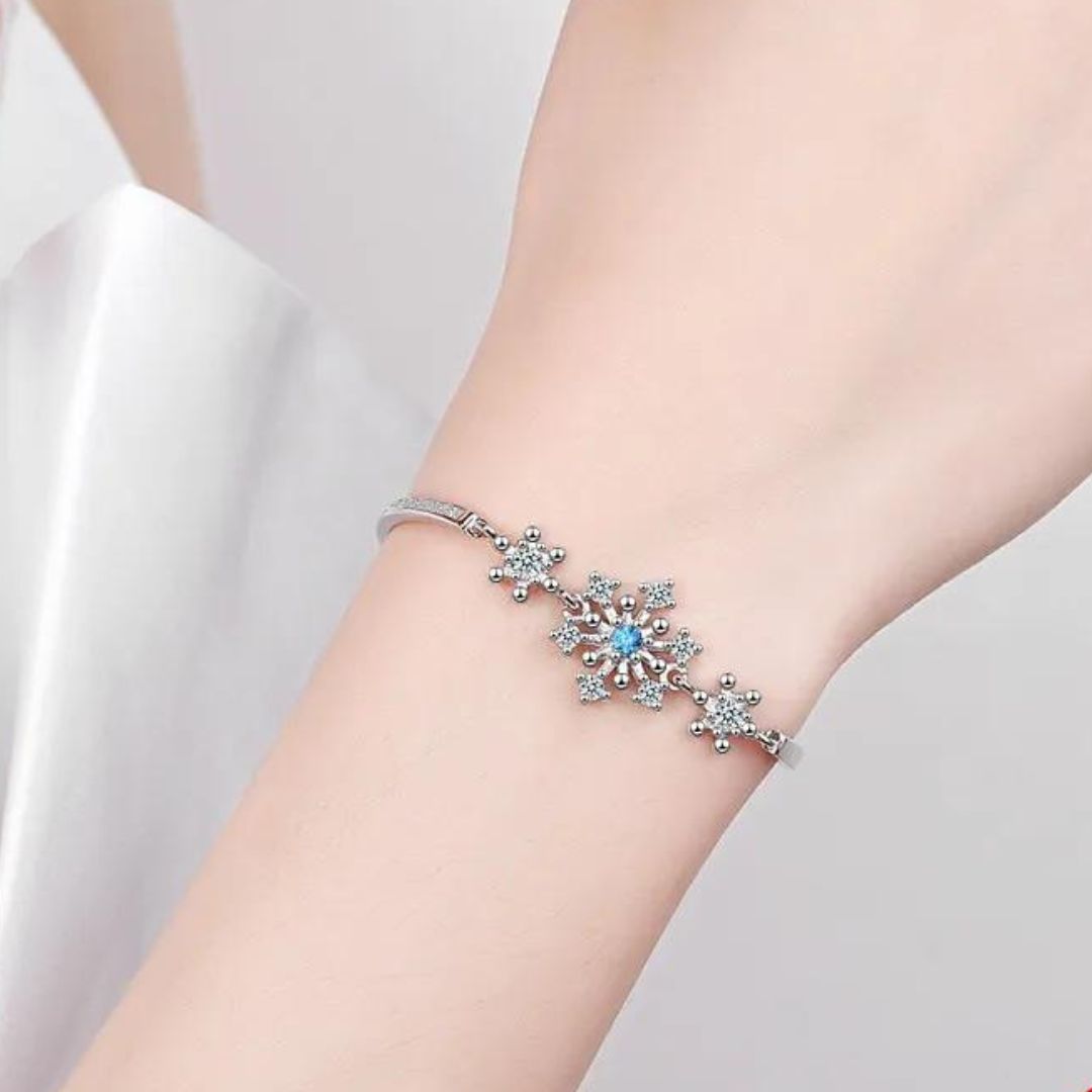 Dazzling cubic zirconia snowflake bracelet for women, adjustable and perfect for holiday sparkle.