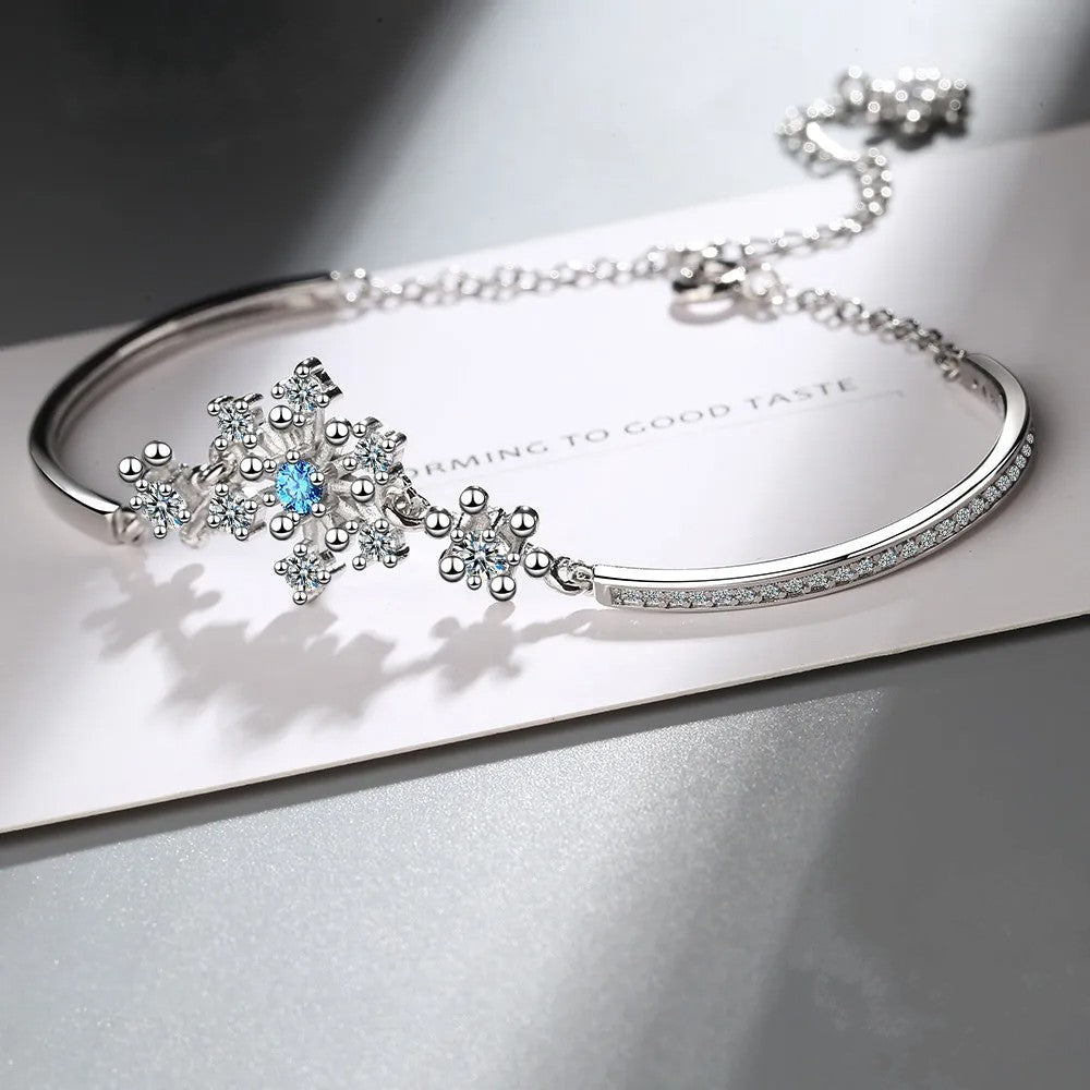 Festive women's snowflake bracelet with sparkling cubic zirconia, ideal Christmas or holiday gift jewelry.
