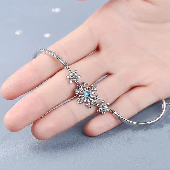 Shimmering women's snowflake bracelet, intricately designed with sparkling cubic zirconia stones for Christmas.