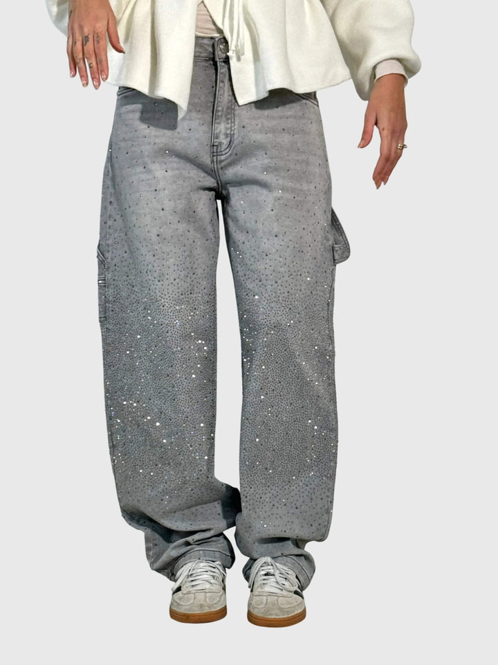 Stylish women's sparkling pants, featuring diamond accents. Modern and versatile fashion statement.