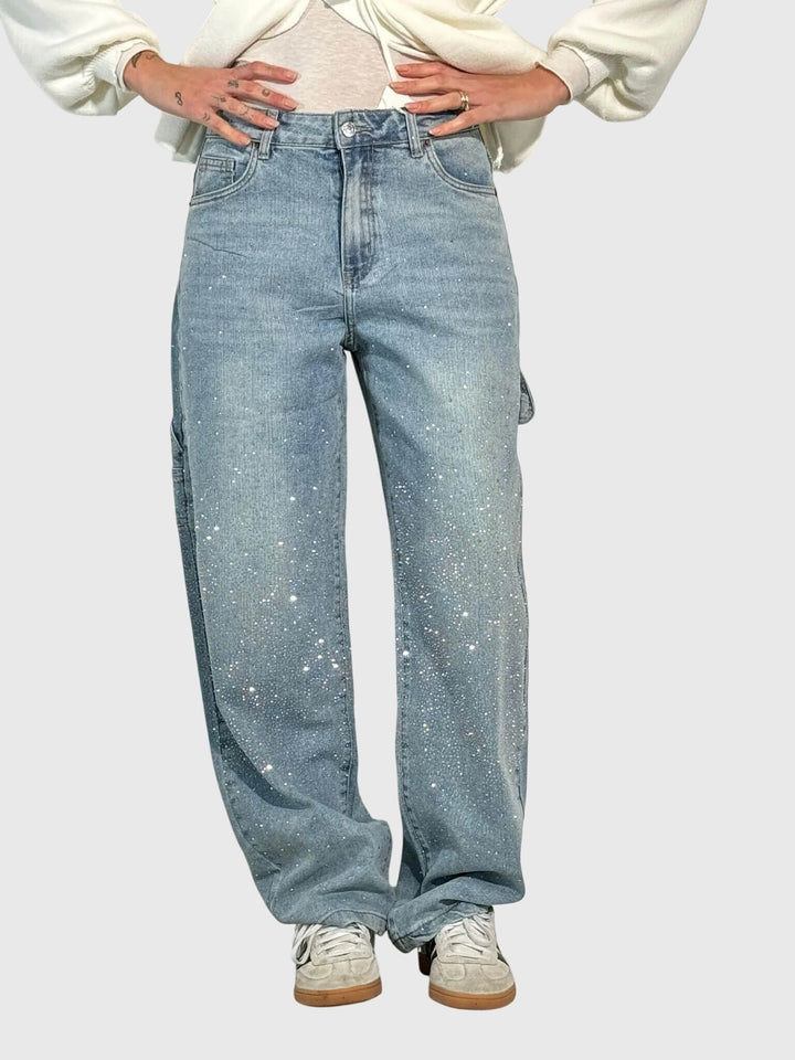 Stylish women's pants with sparkling diamond accents. Chic design for modern women's fashion.