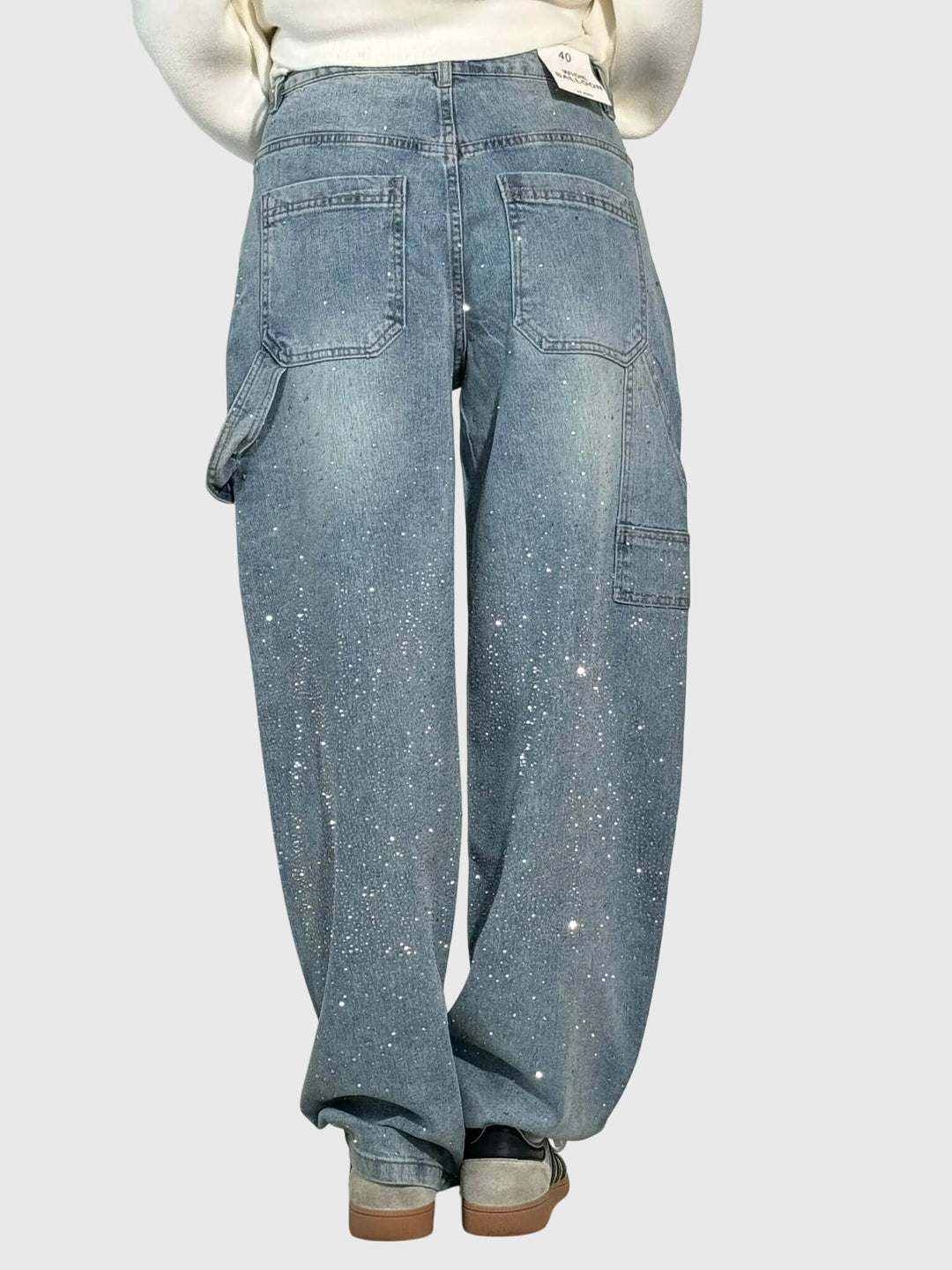 Sparkling diamond women's pants, offering a glamorous loose fit. Ideal for special occasions.