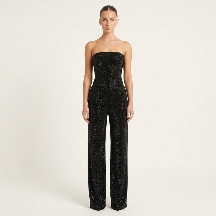 Women's sparkling glitter crop top & high-waist jeans set. Trendy two-piece party outfit.