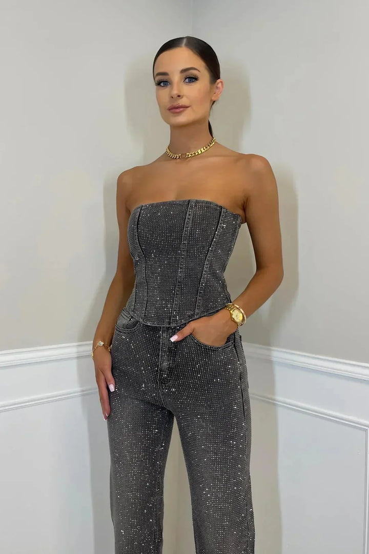 Chic women's sparkling glitter top & high-waist jeans set, versatile for party or evening events.