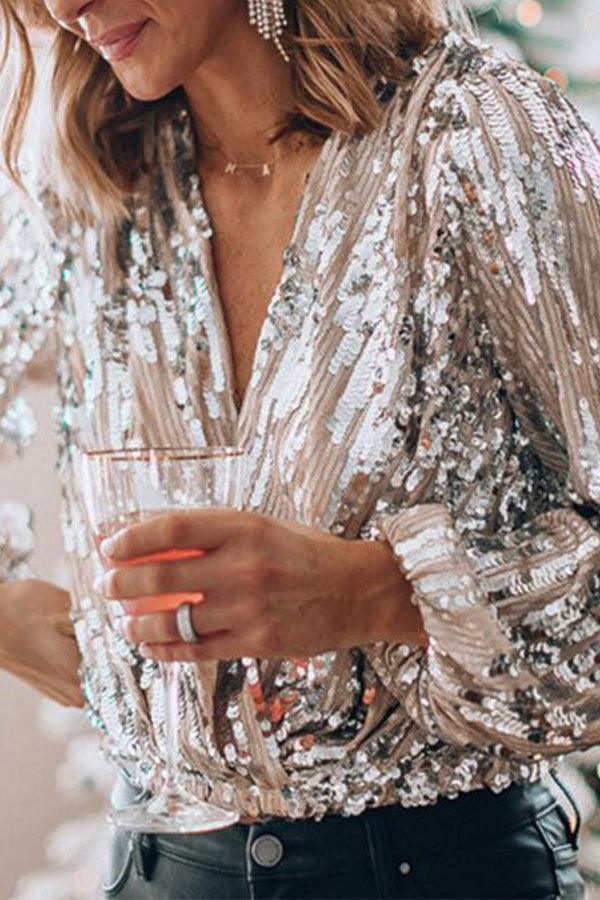 Elegant women's glitter V-neck long sleeve top. Sparkling party wear, a fashionable shirt for any special occasion.