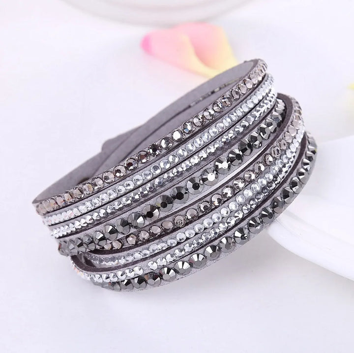Close-up of a glamorous women's layered rhinestone wrap bracelet, perfect for special occasions.