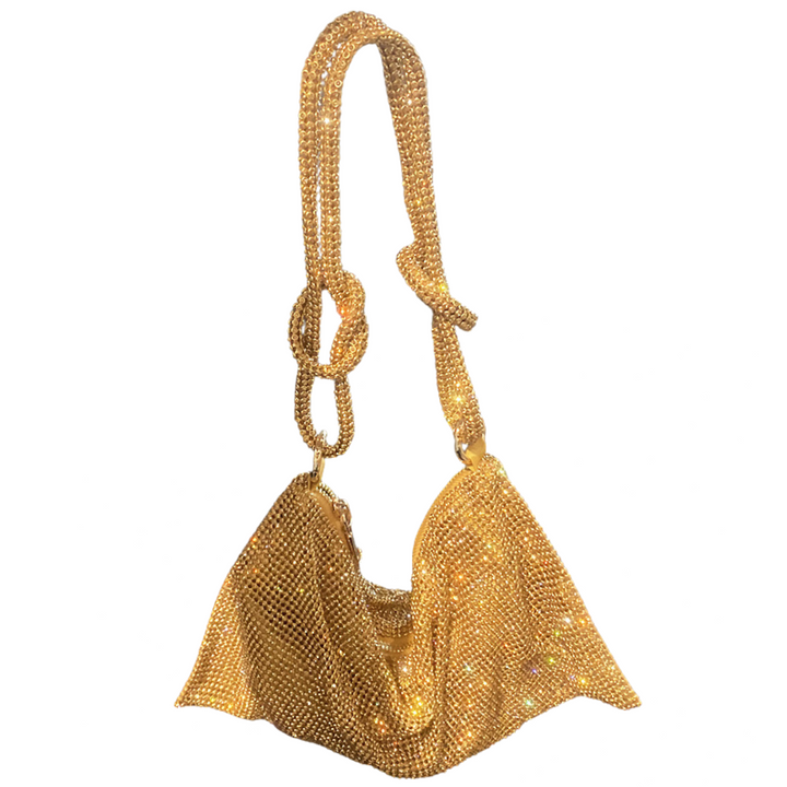 Close-up: Women's sparkling rhinestone clutch bag. Features metallic finish & elegant design.