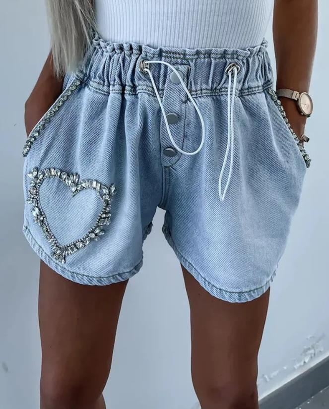 Women's sparkling rhinestone heart denim shorts, perfect for trendy summer parties. Bling fashion bottoms.
