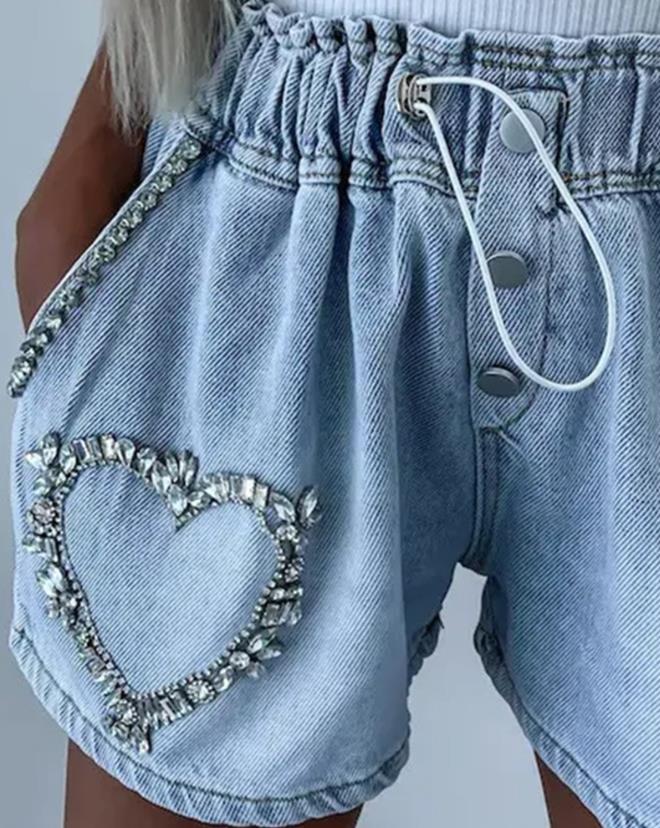 Trendy women's denim shorts with sparkling rhinestone heart design. Ideal for summer fashion & party outfits.