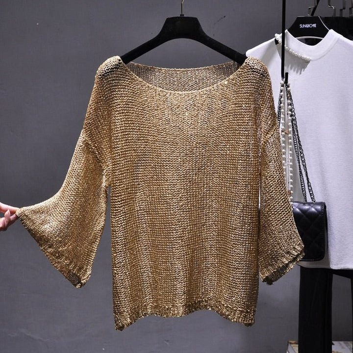 Women's sparkling sequin knit top, perfect for elegant evening wear or a glamorous party outfit.
