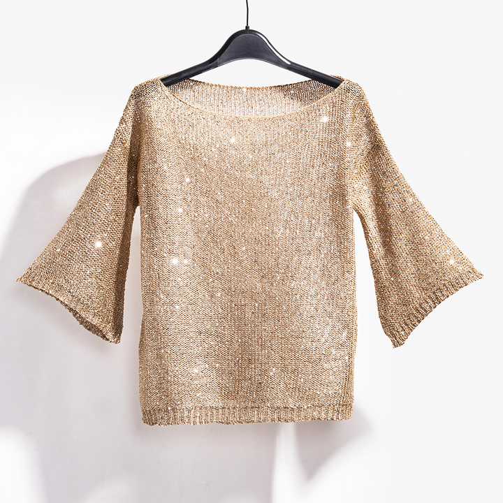 Sparkling sequin knit top for women, a stylish shimmer sweater offering glamour for any evening party.