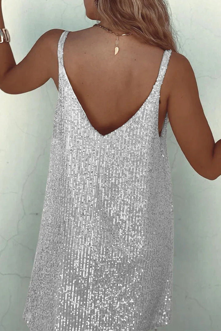 Stunning sequin V-neck cocktail dress. Mini length, sleeveless, women's evening party wear.