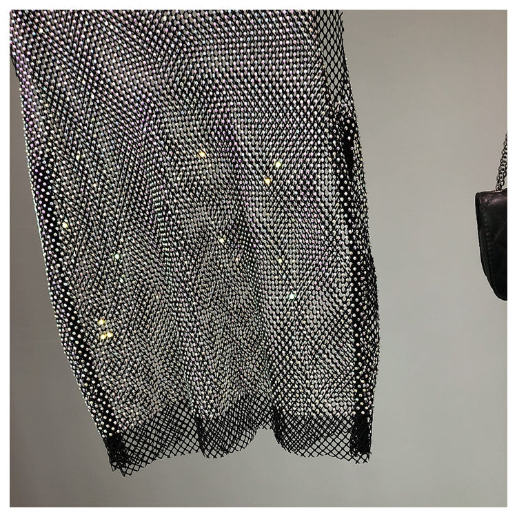 Fashionable women's sleeveless sparkling top, an embellished tank ideal for glamorous parties.