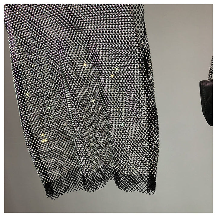 Fashionable women's sleeveless sparkling top, an embellished tank ideal for glamorous parties.