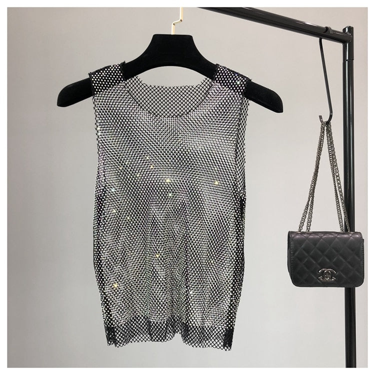Embellished women's sleeveless top, a trendy sparkling party top for going out.