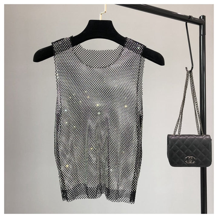 Embellished women's sleeveless top, a trendy sparkling party top for going out.