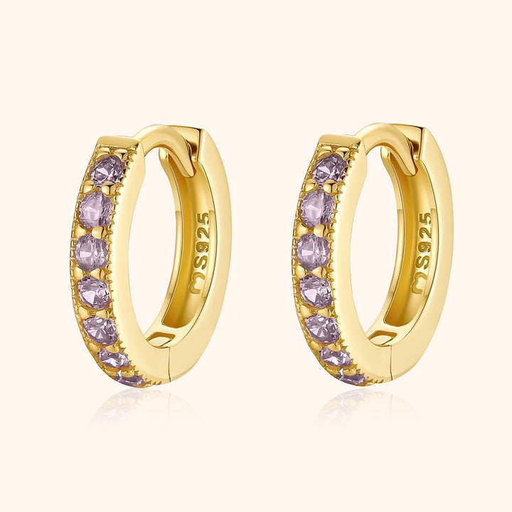Women's sparkling zirconia hoop earrings, gold plated. Dainty & elegant fashion accessory.