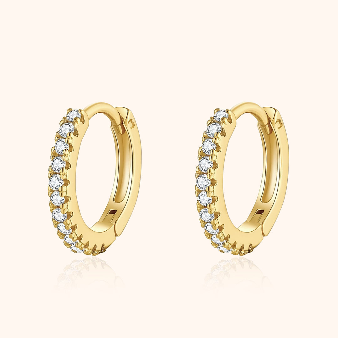 Women's sparkling zirconia hoop earrings. Sterling silver, perfect for elegant fashion or a gift.
