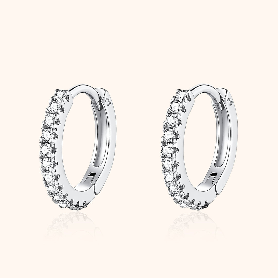Aurina stylish zirconia hoop earrings. Sterling silver with brilliant sparkle, essential womens fashion accessory.