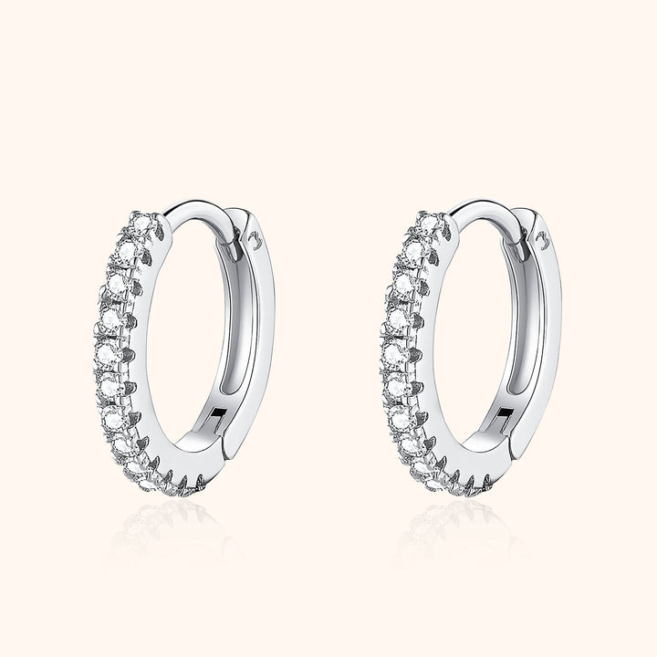 Aurina stylish zirconia hoop earrings. Sterling silver with brilliant sparkle, essential womens fashion accessory.