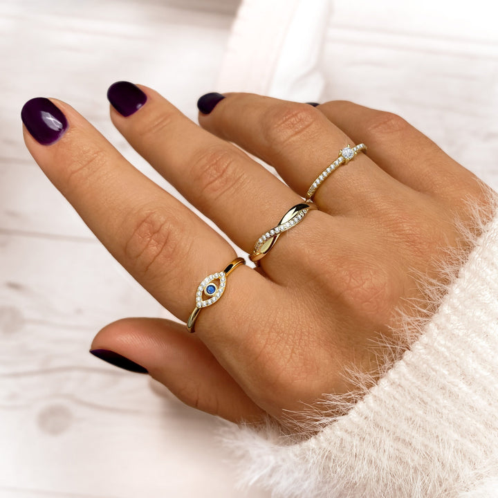 Stylish women's ring with a radiant zirconia solitaire. Gold plated sterling silver fashion jewelry, a stunning gift.