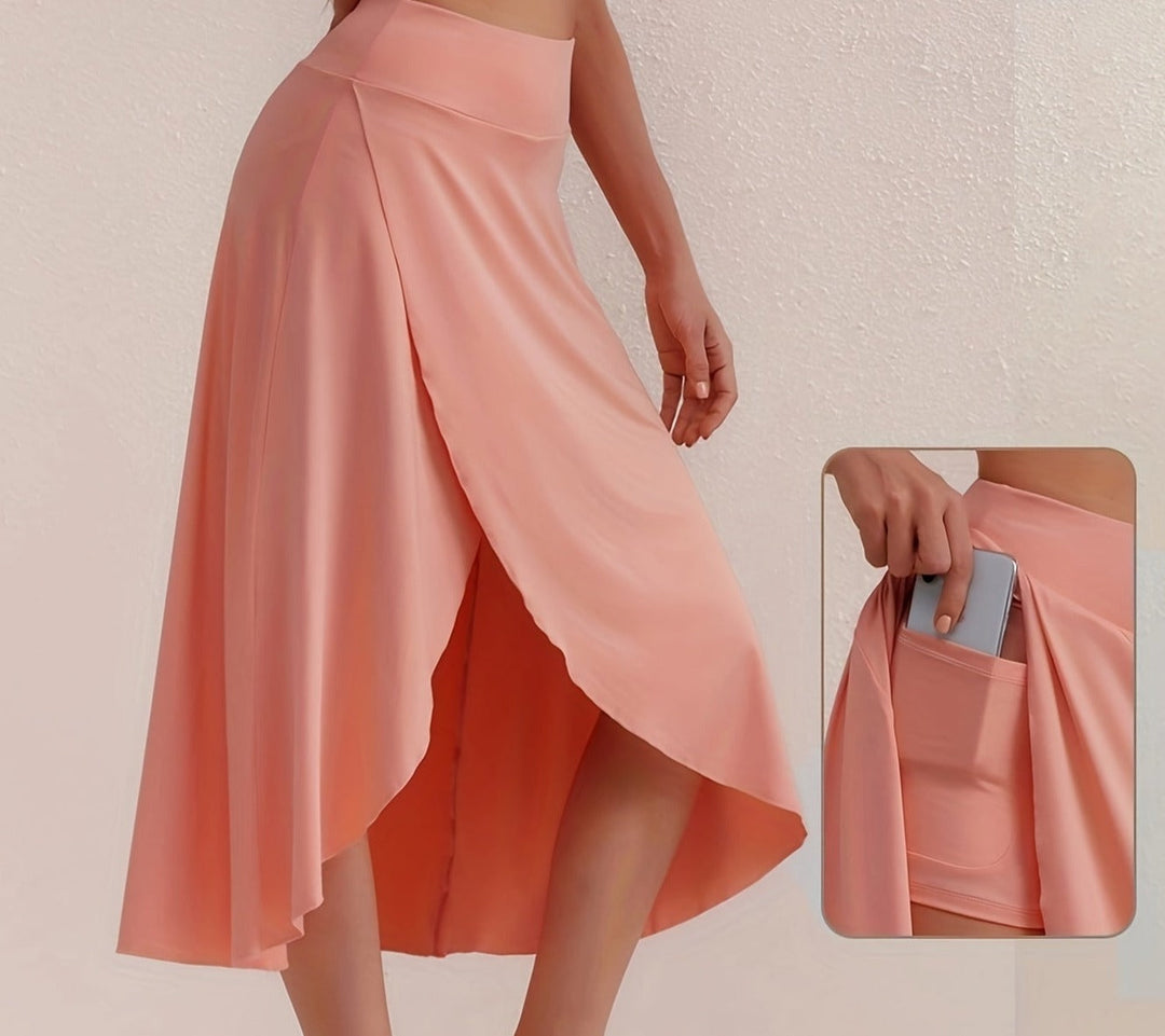 Dynamic women's calf-length asymmetric sporty skirt. High-waisted activewear essential for leisure.