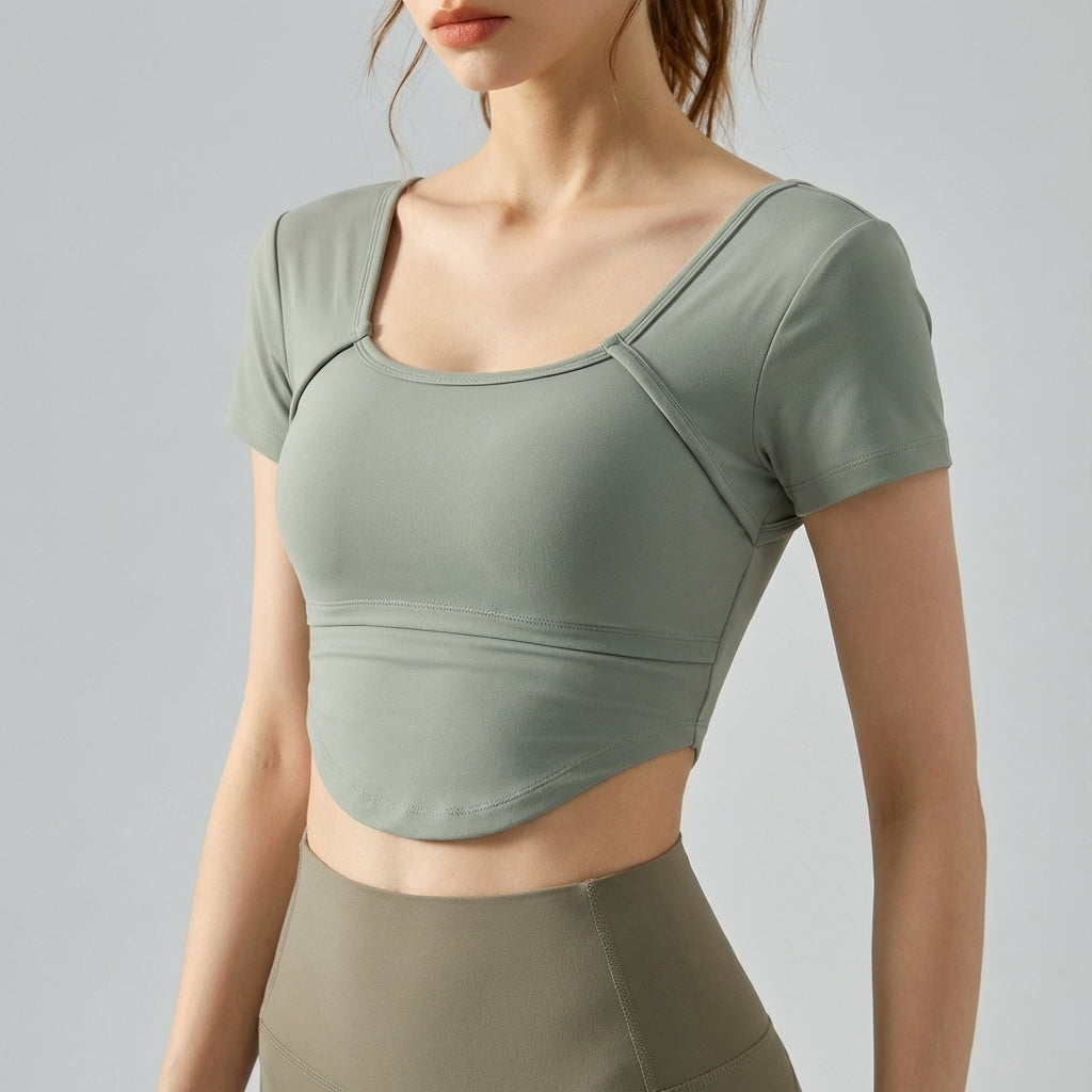 Black 'Bella' women's short-sleeve cropped top, great for workouts or casual outings