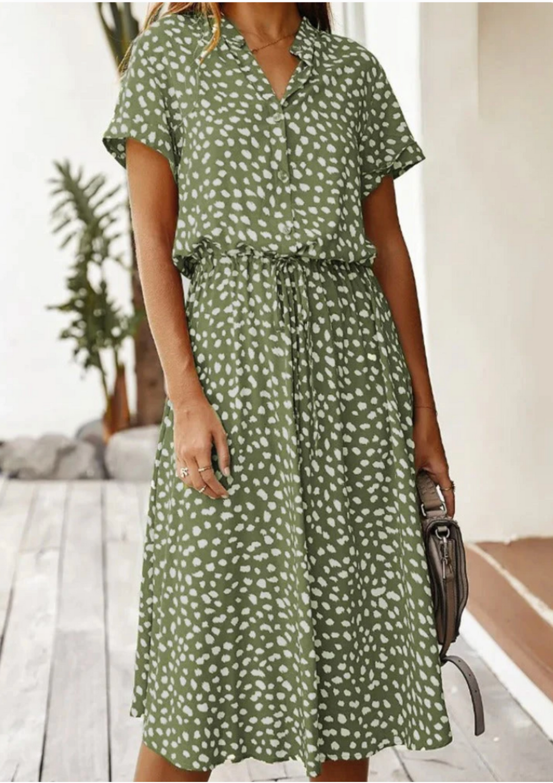 Comfortable women's spotted midi dress, a button-down staple with fashionable flutter sleeves.