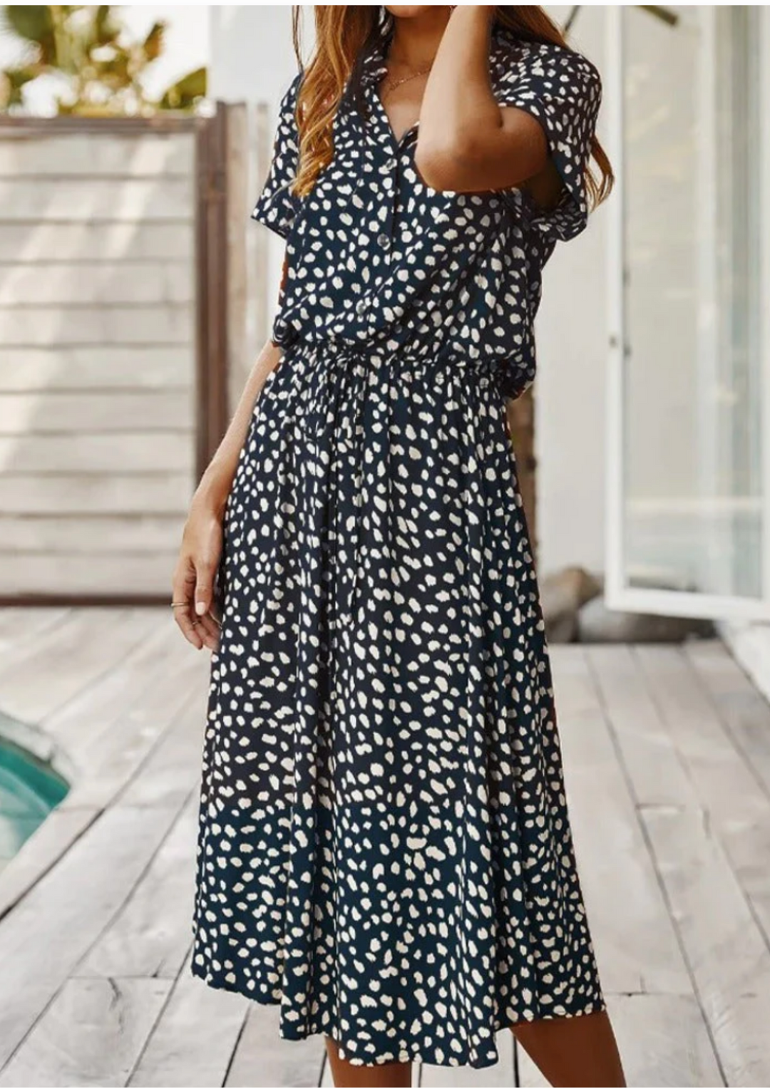 Perfect for warm weather: Women's spotted button-down midi dress with breezy flutter sleeves.