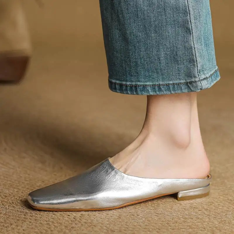 Versatile silver square-toe block heel mules. Women's comfortable slip-on shoes, perfect for adding flair to any outfit.