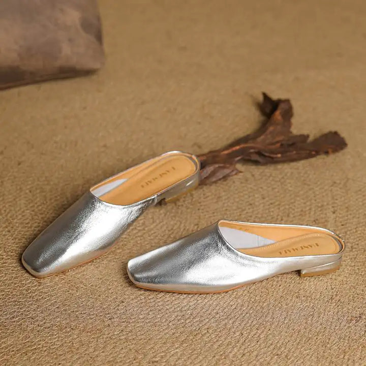 Modern square-toe block heel mules for women. Comfortable, chic slip-on footwear, ideal for contemporary fashion.