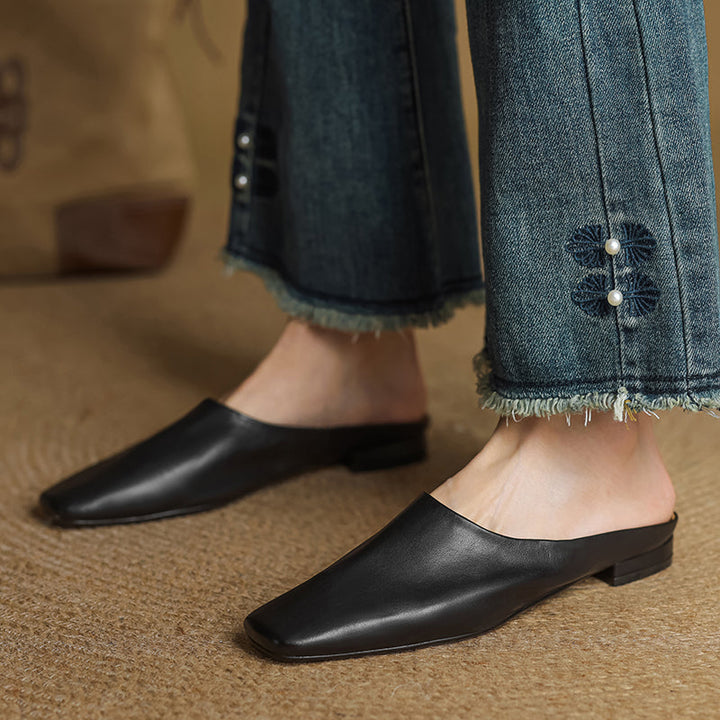 Elegant black square-toe block heel mules for women. Comfortable slip-on shoes, perfect for chic dressy casual wear.
