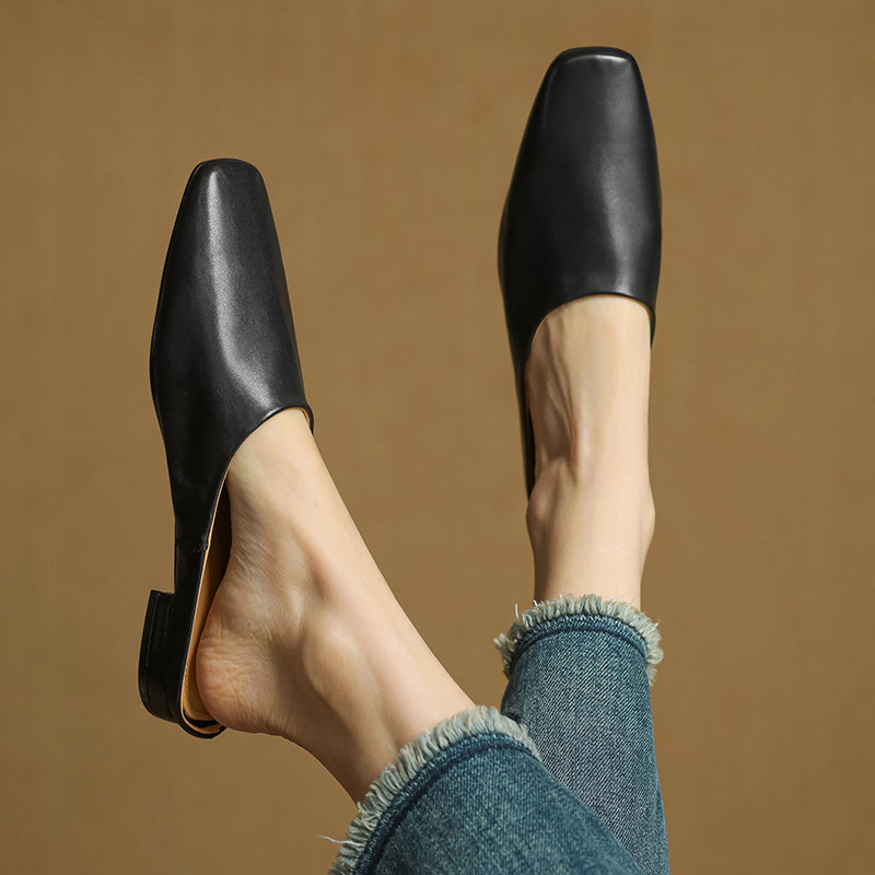 Stylish white square-toe block heel mules. Women's comfortable slip-on shoes for a fresh, elegant everyday look.