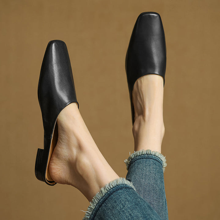 Stylish white square-toe block heel mules. Women's comfortable slip-on shoes for a fresh, elegant everyday look.